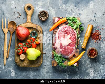 Fresh raw beef steaks on cutting board.Raw fillet steak cooking on stone table Stock Photo