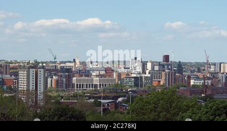 a wide cityscape view of leeds city centre taken from above showing office and apartment buildings the city hall and university Stock Photo