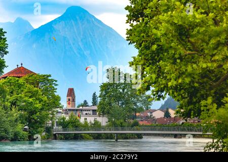 Panoramic view of Old City of Unterseen with Church and Aare river, Interlaken, important tourist center in the Bernese Highlands, Switzerland Stock Photo