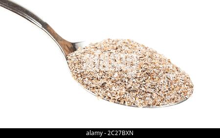 spoon with portion of rye bran close-up isolated on white background Stock Photo