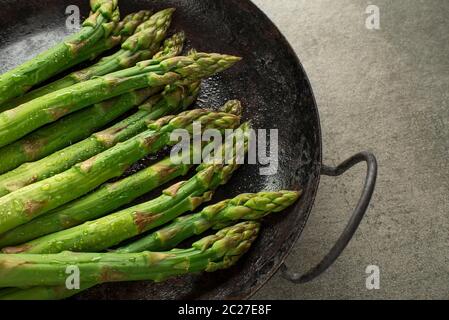 Fresh of green Asparagus. Cooking healthy meal in pan. Bunches of green asparagus Stock Photo