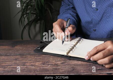 person hand writing on paper, close up  Stock Photo