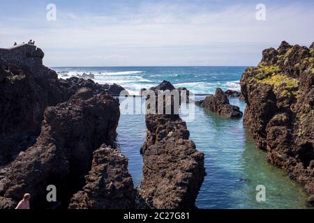 Porto Moniz, Madeira, Portugal - April 18, 2018: Natural rock pool of Porto Moniz on Madeira Island. Portugal.  It is a public bath with water from th Stock Photo