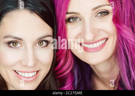 Make-up artist and her woman model posing for the camera Stock Photo