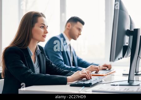 Business people working on computer in his workplace Stock Photo