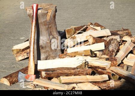 Split firewood with ax and block Stock Photo