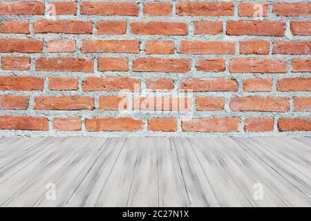 Top of wooden table or counter on brick wall. For product display Stock Photo