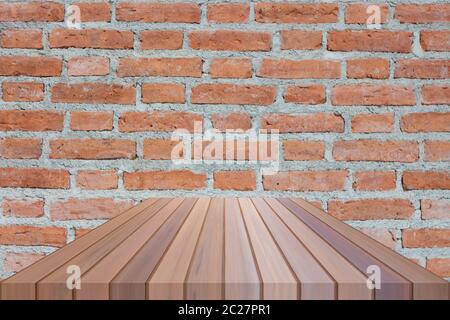 Brown table top on brick wall. For product display Stock Photo