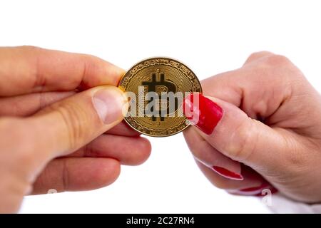 Bitcoin coin in hands Stock Photo