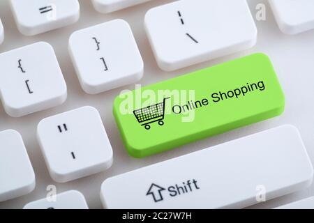 Computer keyboard with online shopping button Stock Photo