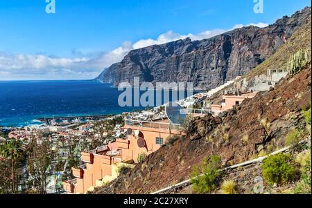 The popular resort Los Gigantes on the northwest coast of Tenerife island, surrounded by the huge basalt cliffs of Acantilado de Los Gigantes. Stock Photo