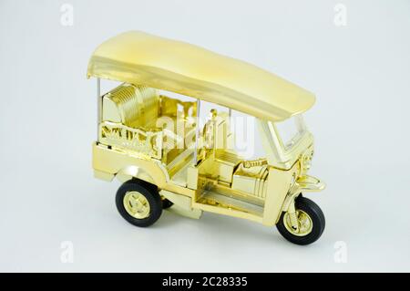 A Miniature Tuktuk on White Background Stock Photo