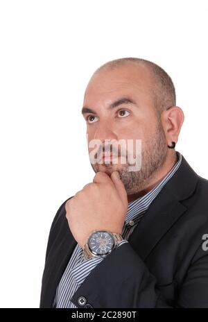 A close up image of an Hispanic middle age man with his hand on his chin and thinking hand, looking up, isolated for white background Stock Photo