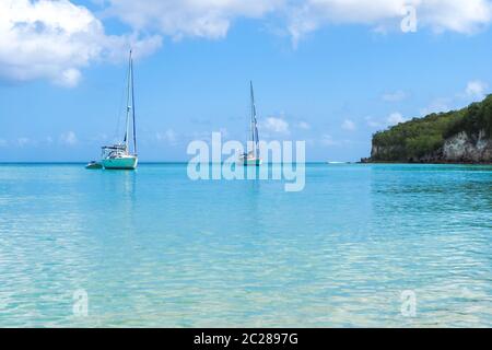 2 yachts moored in Marie Galante turquoise sea, Guadeloupe luxury tourism Stock Photo