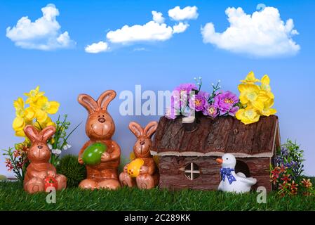 The Easter bunnies in front of the garden house Stock Photo