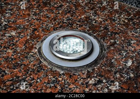 LED backlight in granite stone. Light fixture. Stock Photo