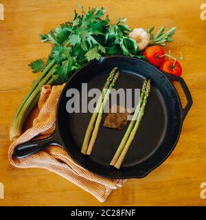 Cast iron pan and vegetables Stock Photo