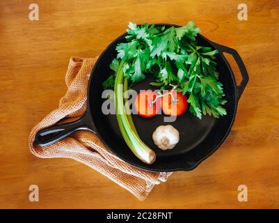 Vegetables in a cast iron pan Stock Photo