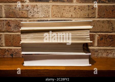 Bookks on a fireplace mantle Stock Photo