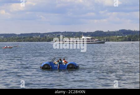 Various watercraft on Lake Constance, pedalo and ferry Stock Photo