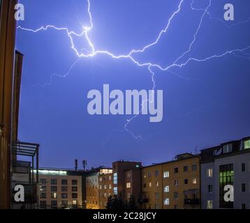 Thunderstorm in the night: Lightning on the sky, urban city, Austria Stock Photo