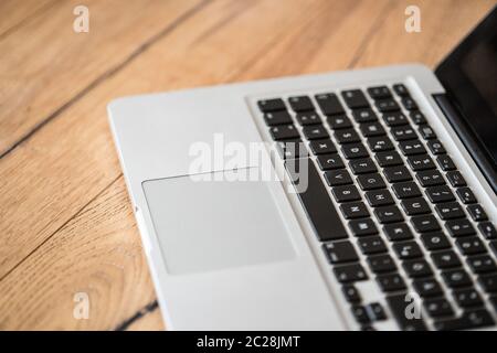 Laptop on a rustic wooden desk, home office Stock Photo