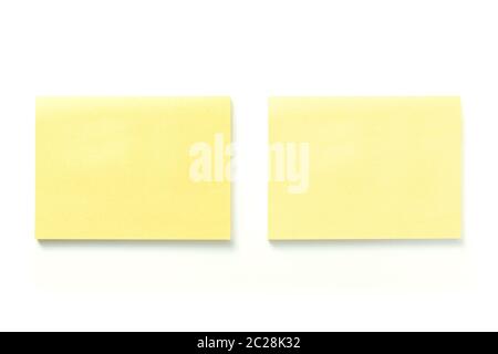 Two blank yellow sticky notes with shadow isolated on white background Stock Photo