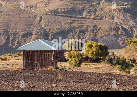 Beautiful mountain landscape with traditional ethiopian house Amhara region near city Lalibela. Ethiopia, Africa. Stock Photo