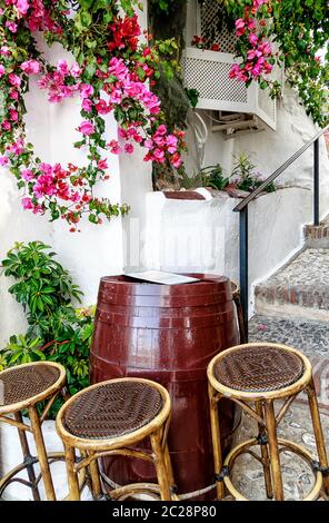 A small bodega in a steep alley of Frigiliana, an old Moorish village above Nerja , one of Andalucia's famous 'White Villages' on the Costa del Sol, province Malaga in Southern Spain. Stock Photo