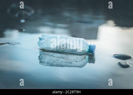 Environmental pollution: plastic bottle on the beach Stock Photo