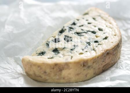 Blue cheese on the white paper Stock Photo