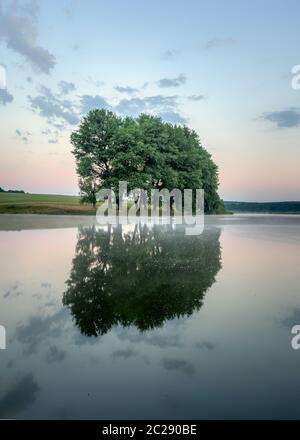 Colorful sunrise on a small lake near the village Stock Photo