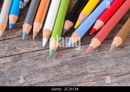 Creativity: Multi-colored pencils on rustic wooden table Stock Photo