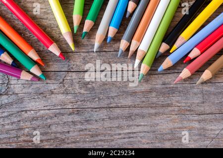 Creativity: Multi-colored pencils on rustic wooden table Stock Photo