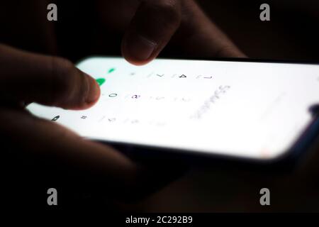 hand writing on mobile keyboard Stock Photo