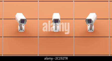 Three CCTV cameras mounted on the wall, front view Stock Photo