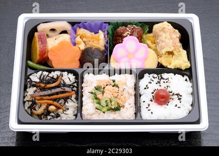 Japanese Makunouchi bento lunch on a black background Stock Photo