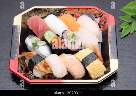 Japanese sushi bento, lunch pack on black background Stock Photo