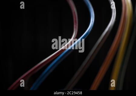 Colored power cables that come from a transformer Stock Photo