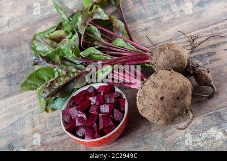 organic beetroots with salad on a wooden background Stock Photo