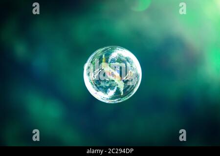Soap bubbles floating in the air, summer time Stock Photo