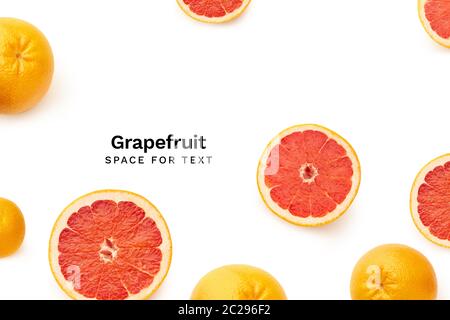 Creative flatlay with fresh sliced grapefruits isolated on white background. Top view with copy space. Fresh citrus fruit Stock Photo