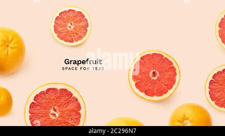 Creative banner flatlay with fresh grapefruits isolated on pink background. Top view with copy space. Fresh citrus fruit Stock Photo