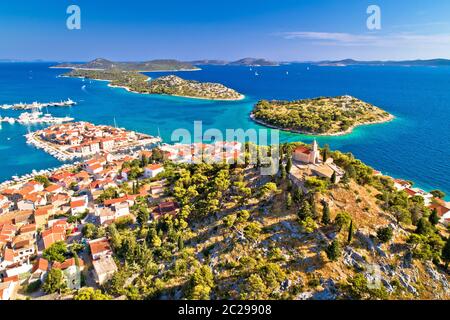 Dalmatian town of Tribunj church on hill and amazing turquoise archipelago aerial view, Dalmatia region of Croatia Stock Photo