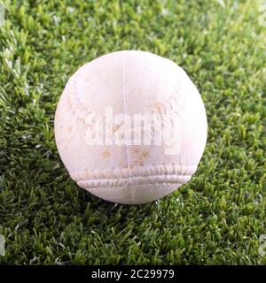 White baseball over synthetic grass, square image Stock Photo