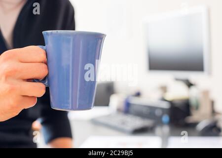 Freelancer in the morning, cup of coffee Stock Photo