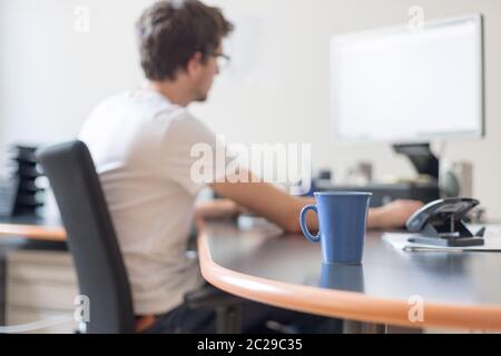 Freelancer in the morning, cup of coffee Stock Photo