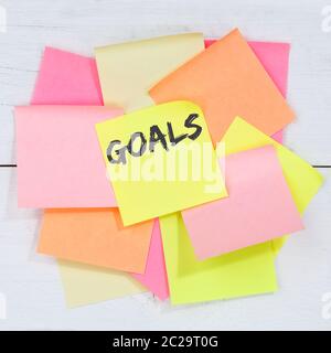 Goal goals to success aspirations and growth business concept desk note paper notepaper Stock Photo