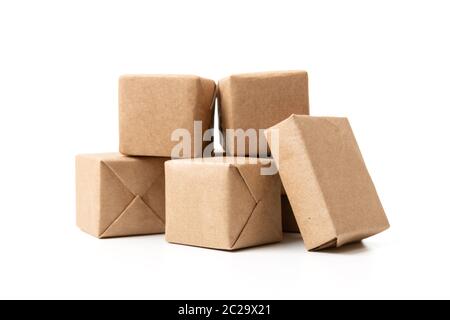 Online shopping and delivery concept. Bunch of express delivery carton boxes. Mini cardboard boxes. Parcel boxes with craft paper. Stock Photo