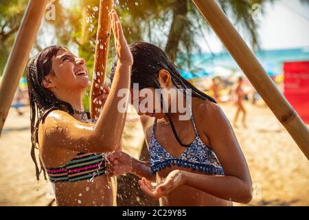 Naked hot babes enjoying a sunny day at the beach